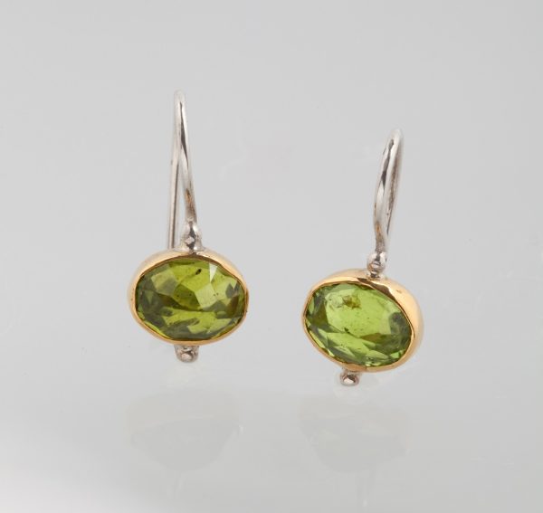 Gold and silver earrings with peridot