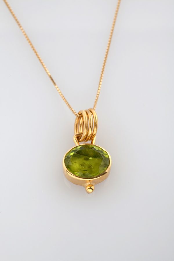 Pendant from gold and silver with peridot