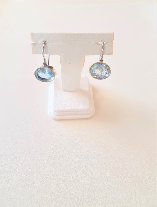 Gold and silver earrings with aqua marine