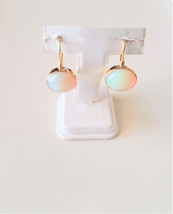 Gold earrings with white opal