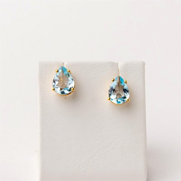 Gold earrings with blue topaz